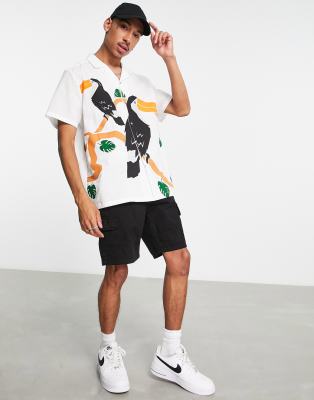 ASOS DESIGN relaxed revere linen look shirt with toucan placement print