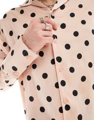 pink and black polka dot shirt