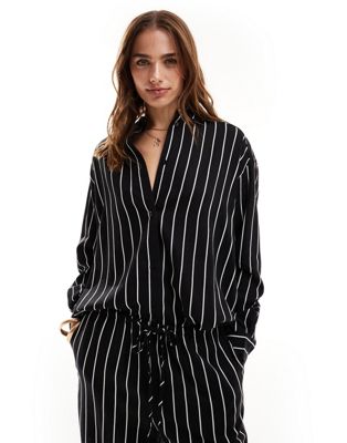 ASOS DESIGN relaxed shirt with linen in black stripe