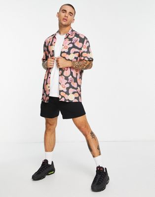 ASOS DESIGN relaxed shirt with spray paint background and fruit motifs
