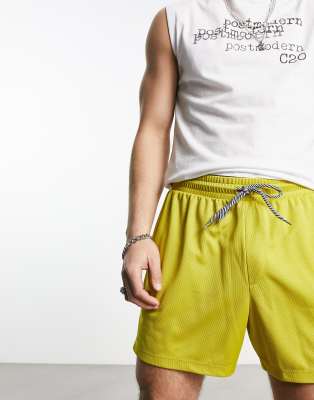 ASOS DESIGN relaxed shorts in mustard yellow sporty mesh