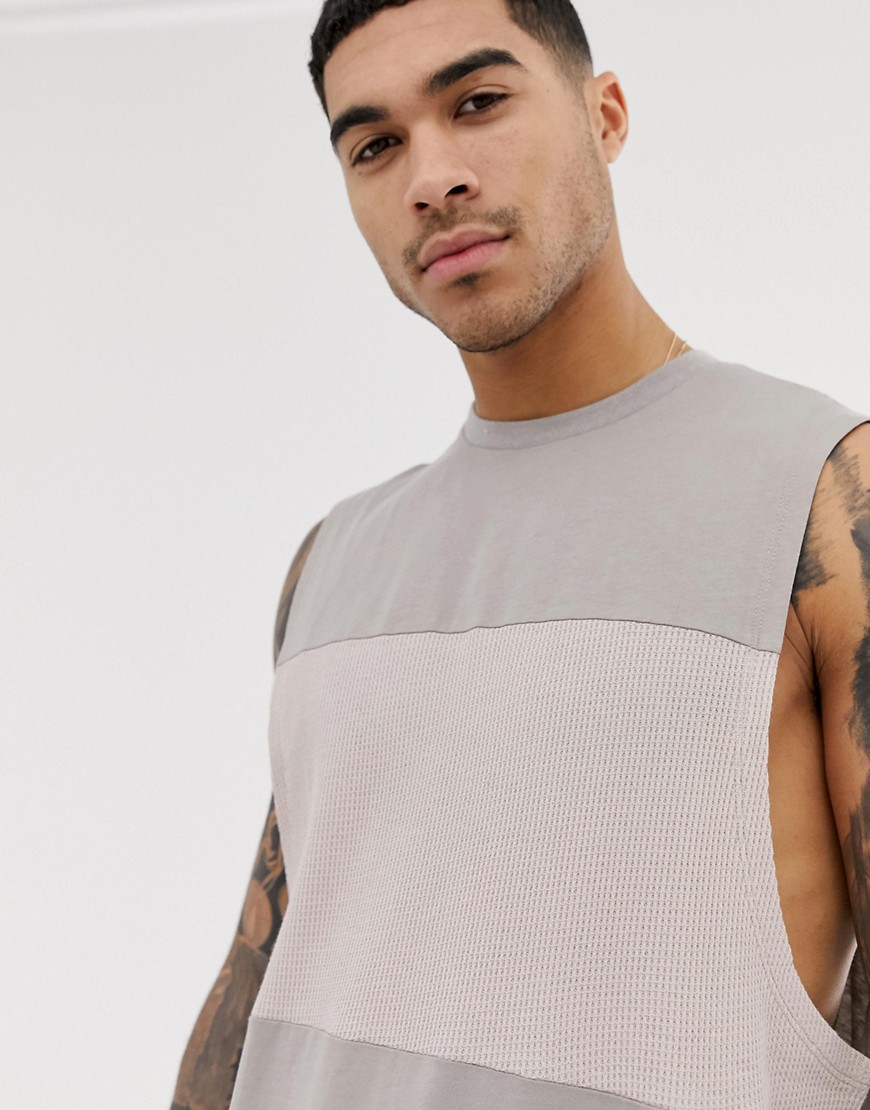 ASOS DESIGN relaxed sleeveless t-shirt with dropped armhole with contrast textured panel-Beige