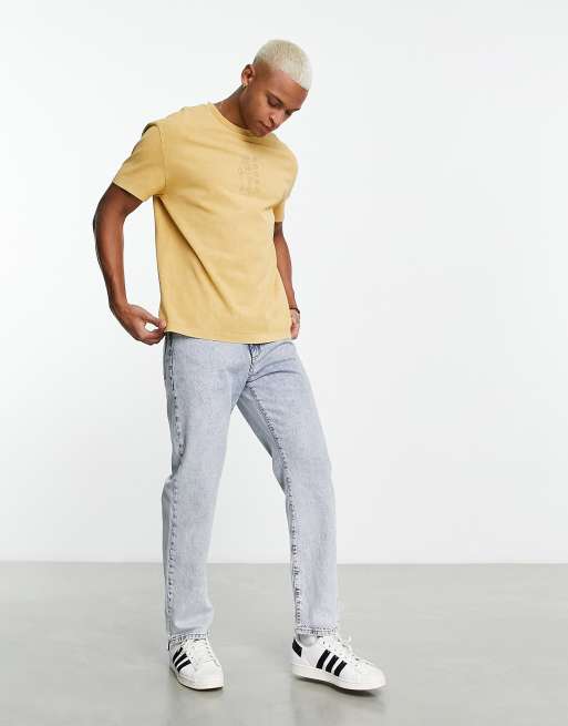 ASOS DESIGN relaxed t-shirt in washed yellow with cowgirl chest