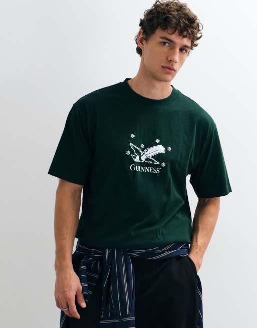ASOS DESIGN relaxed t-shirt with Christmas Guinness print in Green, 2 of 5