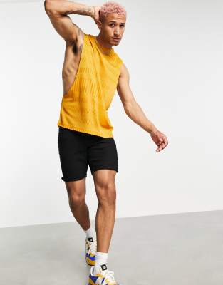 ASOS DESIGN relaxed tank with dropped armhole in mustard rib