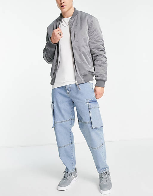 Relaxed tapered Cargo jeans with carpenter detail in Asos Men Clothing Jeans Tapered Jeans 