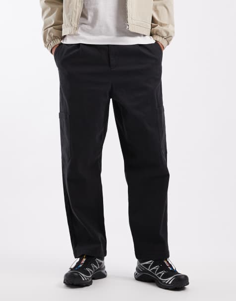 ASOS DESIGN relaxed tapered cargo trousers in black with pleats