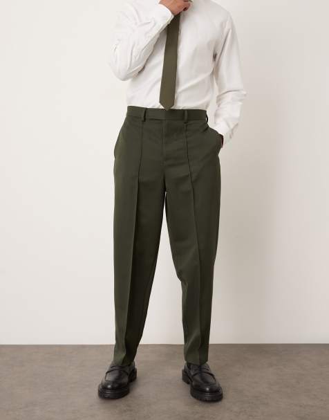 ASOS DESIGN relaxed tapered dress pants with pintucks in dark green - view 1