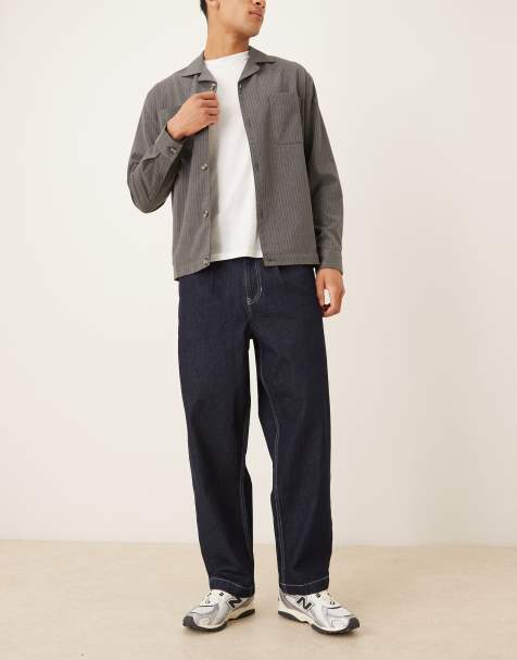 ASOS DESIGN relaxed tapered fit jeans with  pleat detail in black