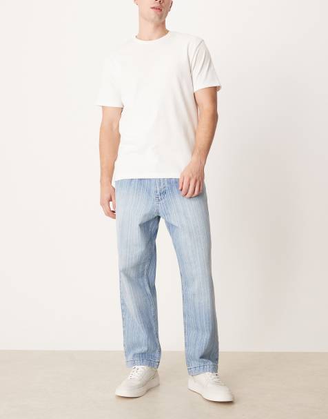 ASOS DESIGN relaxed tapered jeans in light wash blue with stripe print - view 1