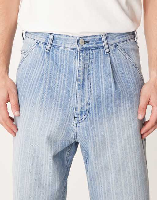 ASOS DESIGN relaxed tapered jeans in light wash blue with stripe print