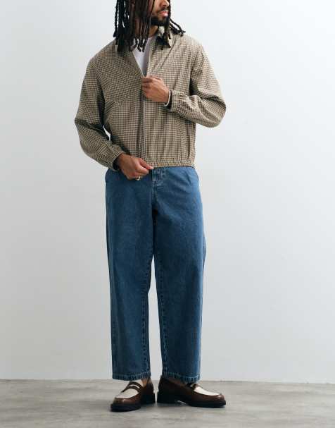 ASOS DESIGN relaxed tapered jeans in mid wash blue with pleats and buckle - view 1