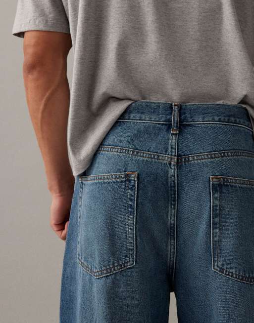 ASOS DESIGN relaxed tapered jeans in mid wash blue with pleats, 3 of 7