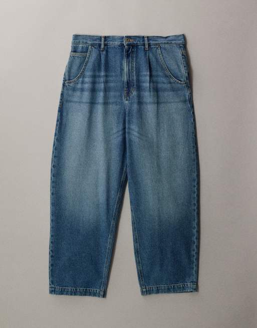 ASOS DESIGN relaxed tapered jeans in mid wash blue with pleats, 5 of 7