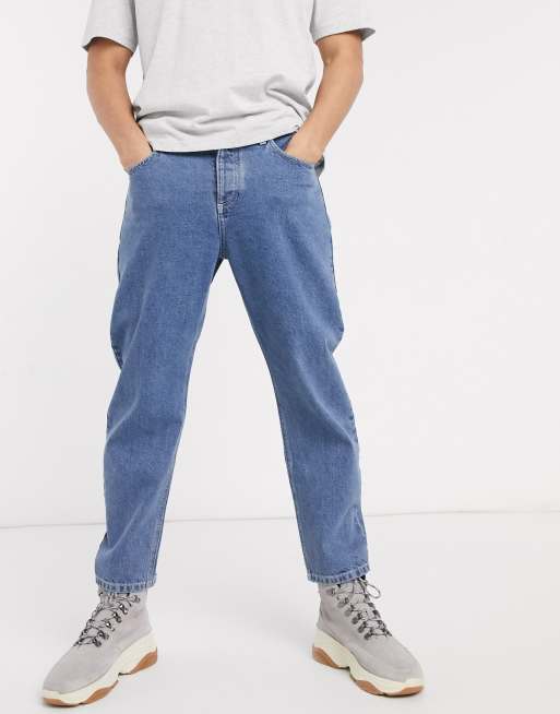 ASOS DESIGN relaxed tapered jeans in mid wash blue | ASOS