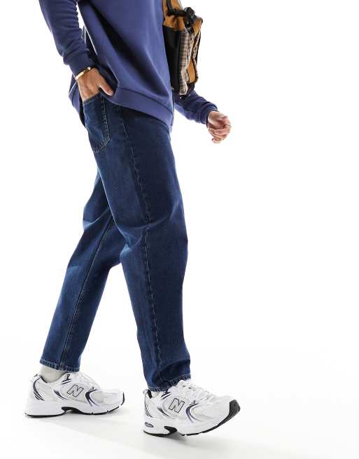 ASOS DESIGN relaxed tapered jeans in mid wash blue