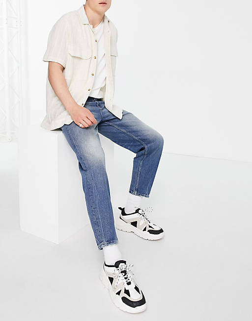 ASOS DESIGN relaxed tapered jeans in tinted dark wash