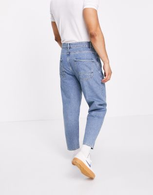 mid wash tapered jeans