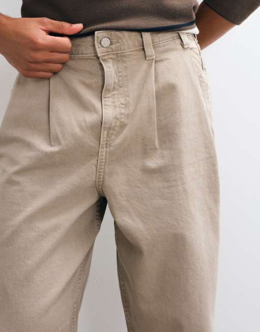 ASOS DESIGN relaxed tapered jeans in washed beige with pleats, 2 of 5