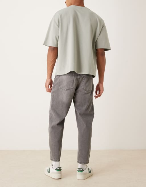 ASOS DESIGN relaxed tapered jeans in washed black with rips, 3 of 5
