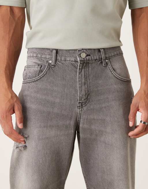 ASOS DESIGN relaxed tapered jeans in washed black with rips