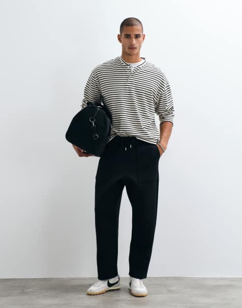 ASOS DESIGN relaxed tapered jogger in scuba-style fabric in black - view 1