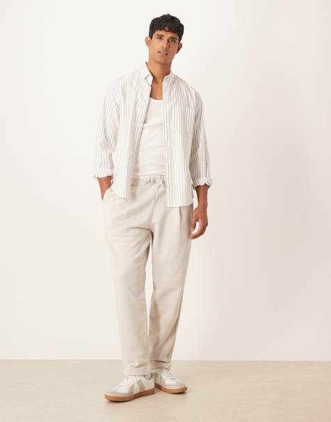 ASOS DESIGN relaxed tapered joggers with pleats in stone - view 1