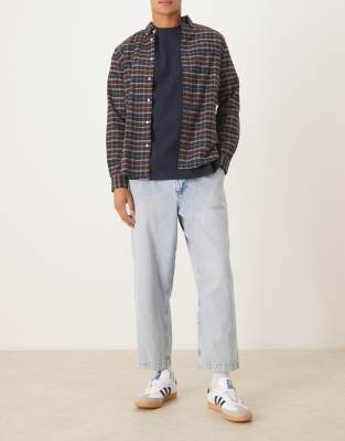 Asos Design Relaxed Tapered Pleated Jeans In Blue