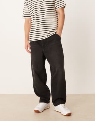 relaxed tapered pleated jeans in washed black