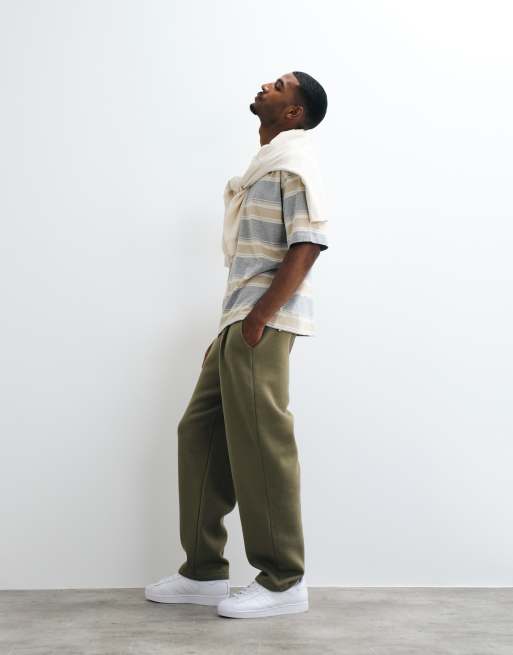 ASOS DESIGN relaxed tapered pleated sweatpants in olive green, 4 of 5