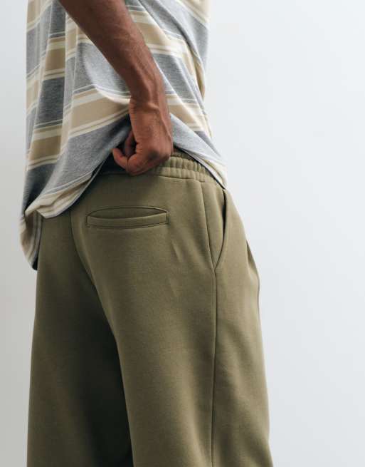ASOS DESIGN relaxed tapered pleated sweatpants in olive green, 5 of 5
