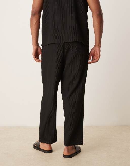 ASOS DESIGN relaxed tapered plisse sweatpants in black