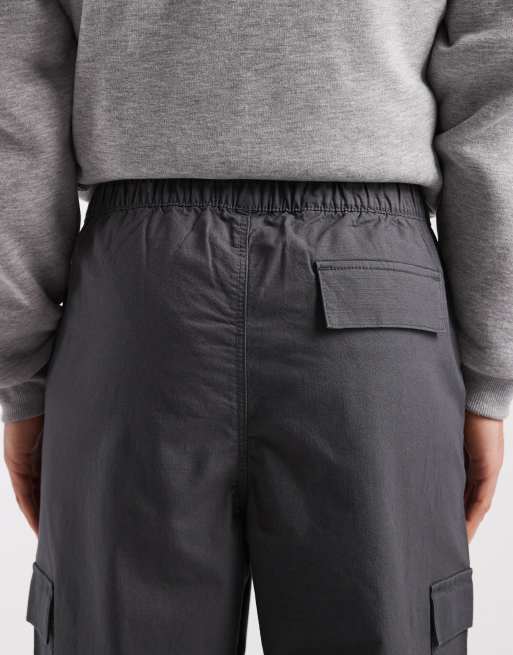 ASOS DESIGN relaxed tapered pull on cargo pants in black ripstop, 4 of 5