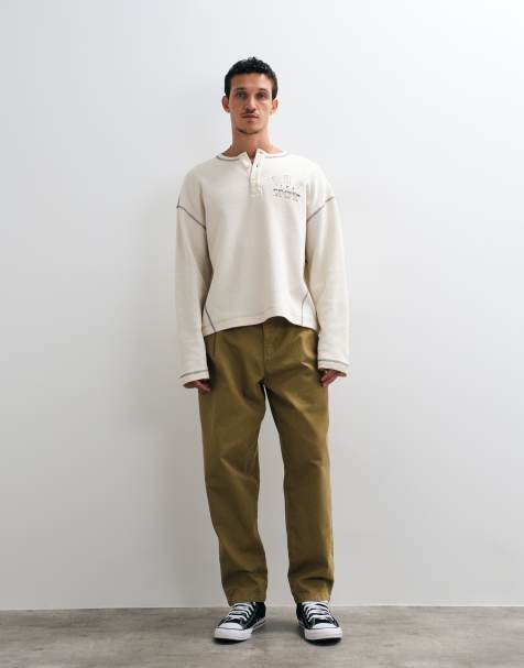 ASOS DESIGN relaxed tapered trouser with belt and pleats in olive
