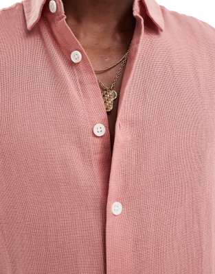 ASOS DESIGN - Chemise décontractée texturée avec poches plaquées - Rose