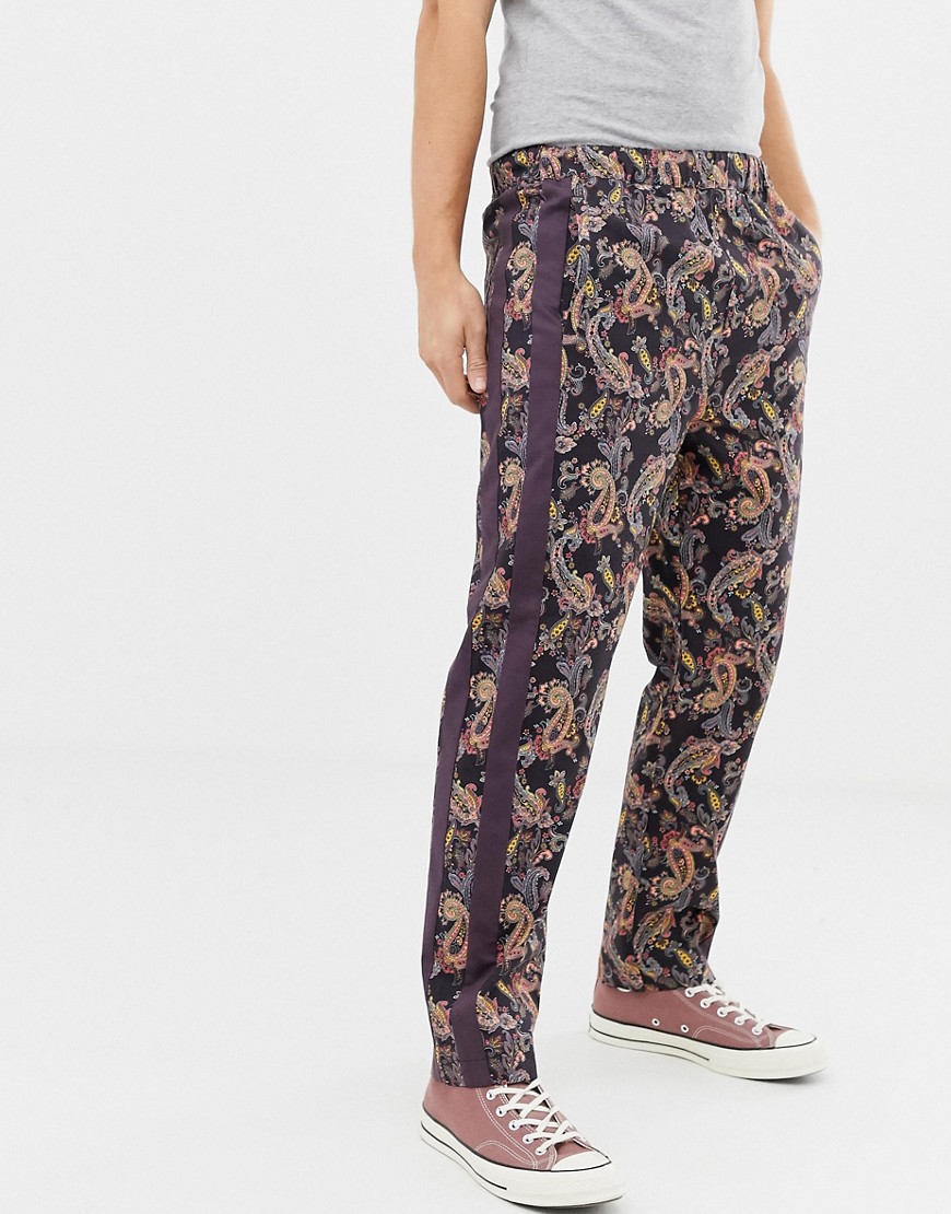 ASOS DESIGN relaxed trousers in paisley print with side tape-Red