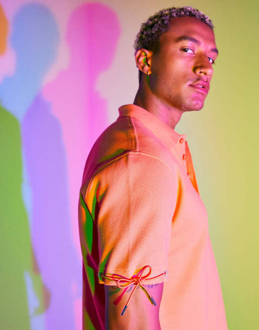 ASOS DESIGN relaxed waffle polo with drawstring details in orange 