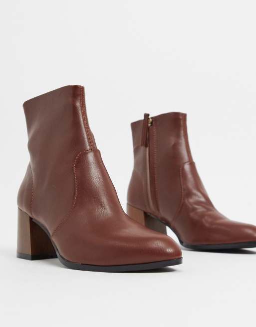 ASOS DESIGN Reporter heeled boots with flared wooden heel in brown