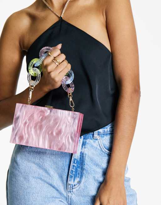 ASOS DESIGN resin clutch bag with detachable multi colored chain in pink