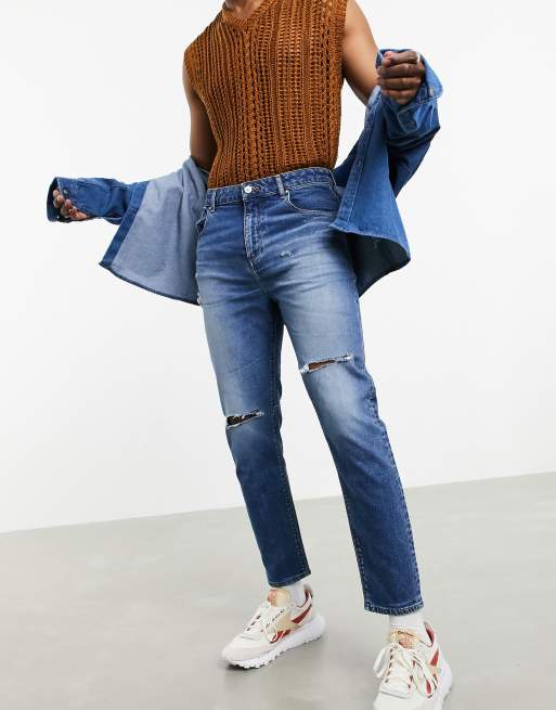 ASOS DESIGN 'Responsible Edit' tapered carrot fit jeans in mid wash blue with rips ASOS