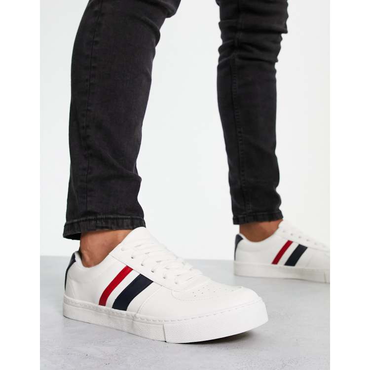 White shoes with 2025 blue and red stripes