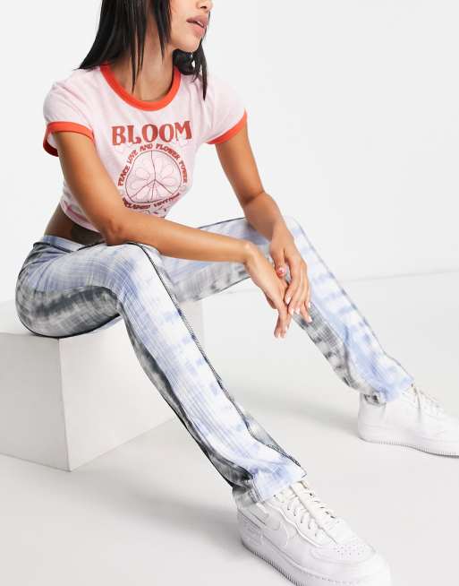 ASOS DESIGN rib flare pants with exposed seam in cut about tie dye print
