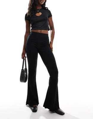 Asos Design Rib Flare Pants With Lettuce Hem In Black In Black