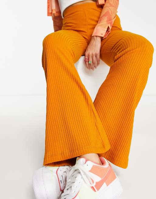 ASOS DESIGN rib kick flare pant in mustard orange