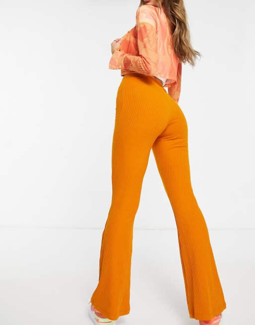 ASOS DESIGN retro floral flare pants in orange