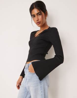 Asos Design Rib Knit V Neck Top With Lace Trim And Flared Sleeves In Black