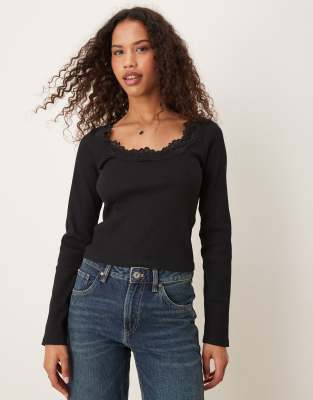 ribbed round neck long sleeve top with lace trim in black
