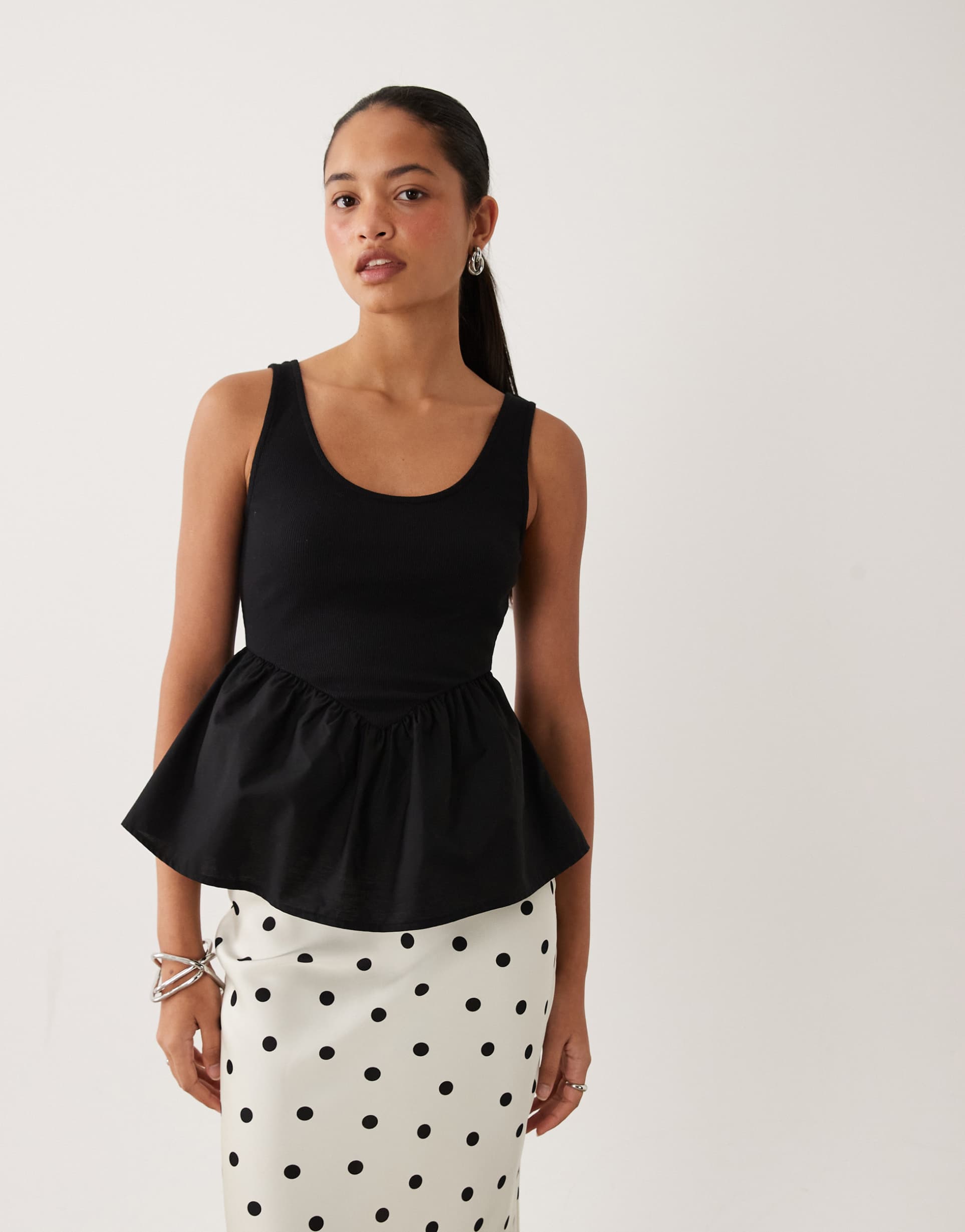 asos design ribbed scoop neck cami with peplum hem in black