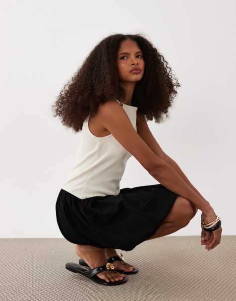 ASOS DESIGN ribbed sleeveless bubble hem mini dress in black & cream - view 1