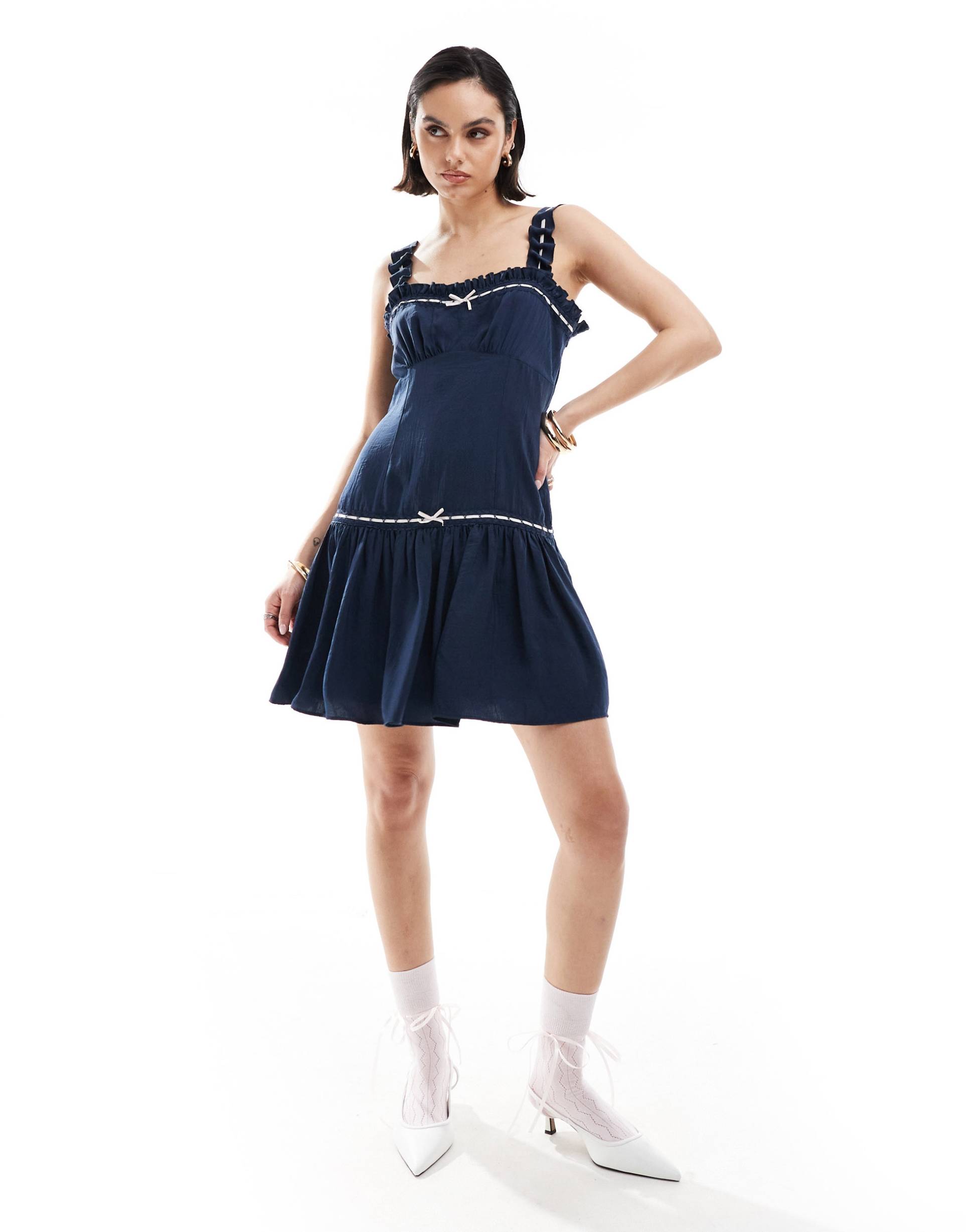 asos design ribbon frill strap mini dress with flippy hem in navy